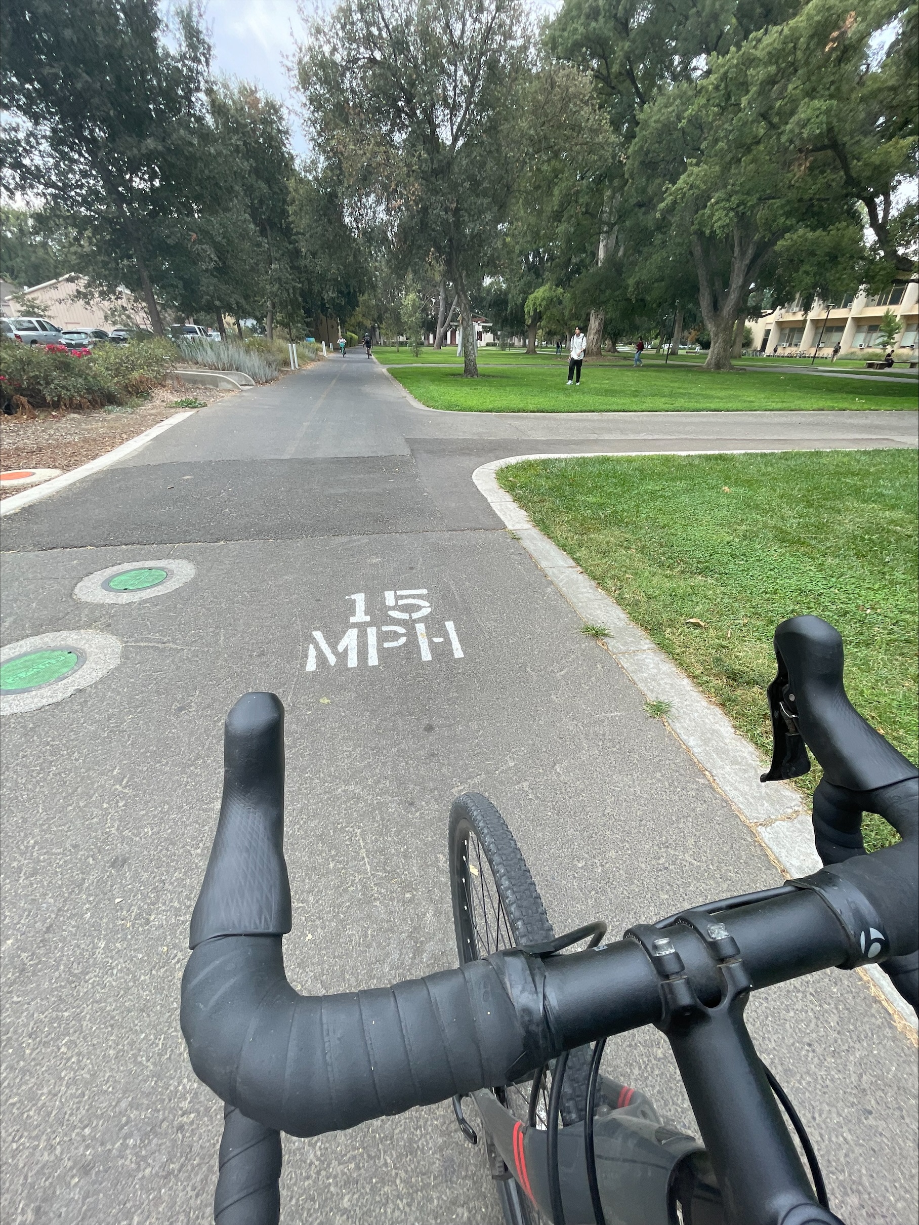 bike on path with 15mph painted on path surface in white