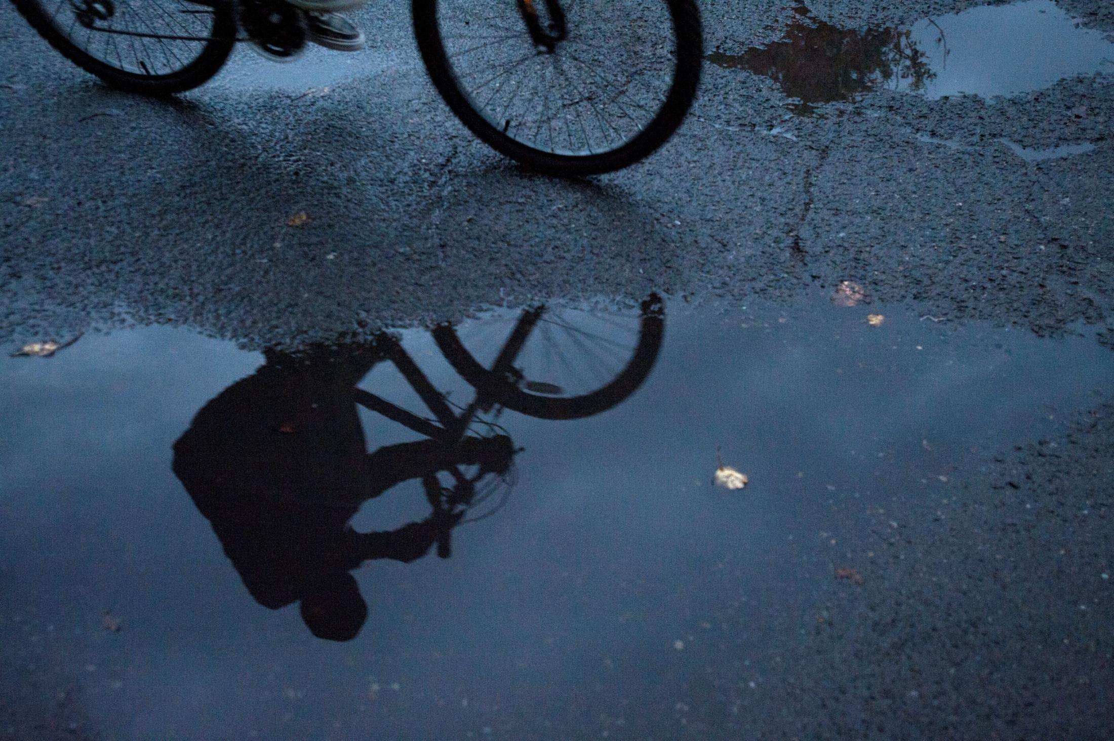 Bicycle reflection in puddle, rainy bike ride illustration