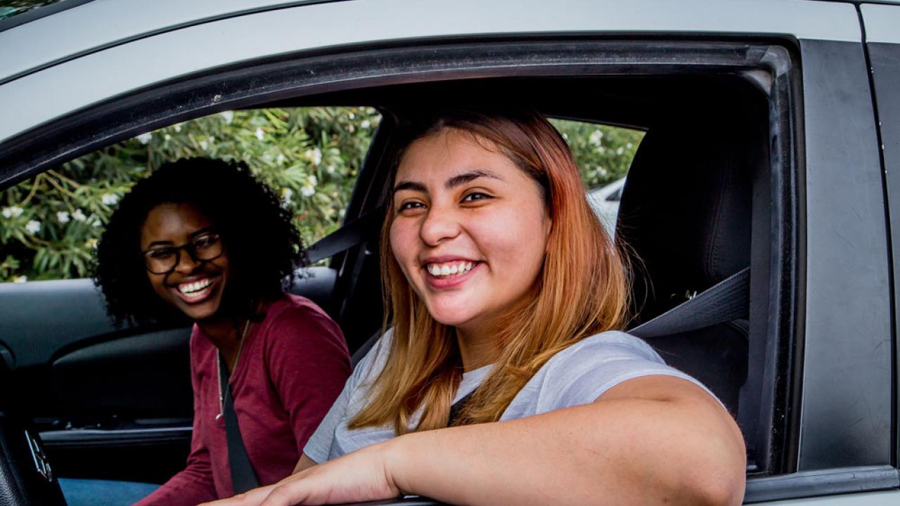 students driving in car