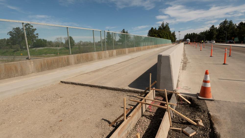 Photo from construction on Hutchinson and 113 Overpass, showing bike path in progress.