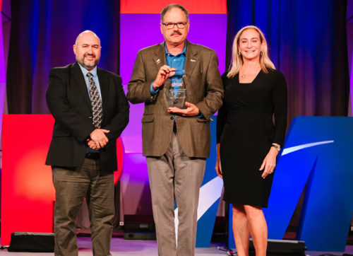 Perry accepting IPMI Industry of the Year Award