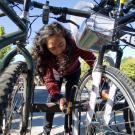 Student locking up bicycle
