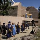 people stand in line for graduation ceremony